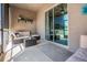 Outdoor patio with comfortable seating, plants, and sliding glass doors at 12107 Rambling Stream Dr, Riverview, FL 33569