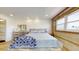 Bright bedroom featuring a wood dresser, comfy bed, and an airy open concept at 12405 3Rd E St # 306, Treasure Island, FL 33706