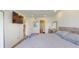 Bright bedroom featuring a comfy bed, wood dresser, and a mounted flatscreen at 12405 3Rd E St # 306, Treasure Island, FL 33706