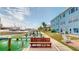 Outdoor patio next to the boat dock overlooking the clear water and boats, on a sunny day at 12405 3Rd E St # 306, Treasure Island, FL 33706
