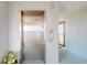 A view of an elevator in the building, alongside the entrance and hallway at 12405 3Rd E St # 306, Treasure Island, FL 33706