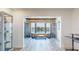 Bright sitting area with water views, modern furnishings, and plenty of natural light from the large picture window at 12405 3Rd E St # 306, Treasure Island, FL 33706