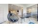 The main living space featuring modern furniture, including chairs, and sliders leading to a bedroom at 12405 3Rd E St # 306, Treasure Island, FL 33706