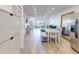 Open concept living space with dining area and comfortable seating overlooking the waterfront at 12405 3Rd E St # 306, Treasure Island, FL 33706