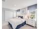 Bright bedroom featuring a comfortable bed, ample natural light, and closet space for storage at 12406 Gust Ct, Hudson, FL 34669
