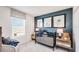 Cozy bedroom design features plush carpet, baseball-themed decor and a bedside table with lamp providing ambient lighting at 12406 Gust Ct, Hudson, FL 34669