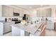 A spacious kitchen showcases an island with granite countertops, stainless steel appliances and lots of natural light at 12406 Gust Ct, Hudson, FL 34669
