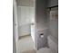 Neat bathroom with toilet, shower, closet and single sink vanity at 13813 Mission Oaks Blvd, Seminole, FL 33776