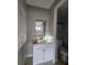A clean bathroom featuring a single sink vanity and a toilet at 13813 Mission Oaks Blvd, Seminole, FL 33776