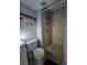 Cozy bathroom featuring a walk-in shower with neutral tile and a modern toilet at 13813 Mission Oaks Blvd, Seminole, FL 33776
