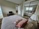 Bright bedroom with mirrored closet and colorful pillows at 13813 Mission Oaks Blvd, Seminole, FL 33776