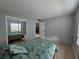 Bright bedroom featuring a mirrored closet offering ample storage space at 13813 Mission Oaks Blvd, Seminole, FL 33776