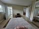 Bedroom with a sliding door and access to the living room at 13813 Mission Oaks Blvd, Seminole, FL 33776