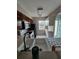 Bright kitchen with neutral countertops, white appliances, double basin sink, and view to the dining room at 13813 Mission Oaks Blvd, Seminole, FL 33776