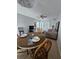 Open living space featuring neutral walls, tile floors, a dining area and views to the other rooms in the home at 13813 Mission Oaks Blvd, Seminole, FL 33776