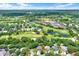 Picturesque community featuring a lush golf course, mature trees, and well-maintained homes at 13902 Bardmoor Pl # B, Tampa, FL 33618