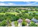 Expansive aerial view of a residential area with lush landscaping, a golf course, and inviting community amenities at 13902 Bardmoor Pl # B, Tampa, FL 33618