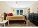 Bedroom with natural light, warm colors, and wood floors at 13902 Bardmoor Pl # B, Tampa, FL 33618