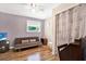 Comfortable bedroom featuring hardwood floors and gray accent wall at 13902 Bardmoor Pl # B, Tampa, FL 33618