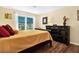 Bedroom with natural light, warm colors, and wood floors at 13902 Bardmoor Pl # B, Tampa, FL 33618