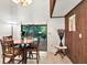 Cozy dining area with wood accents and a view to the outdoor patio at 13902 Bardmoor Pl # B, Tampa, FL 33618