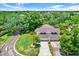 Charming two-story home featuring a lush green lawn, mature trees, and a two-car garage at 13902 Bardmoor Pl # B, Tampa, FL 33618