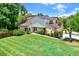 Charming two-story home featuring a spacious front yard and beautifully landscaped garden at 13902 Bardmoor Pl # B, Tampa, FL 33618