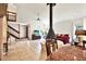 Open living room featuring a striking fireplace and view to staircase at 13902 Bardmoor Pl # B, Tampa, FL 33618