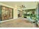 Enclosed porch with seating and sliding doors at 13902 Bardmoor Pl # B, Tampa, FL 33618