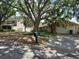 Lovely home with stone accents, palm trees, and a driveway leading to an attached two-car garage at 1425 Corner Oaks Dr, Brandon, FL 33510