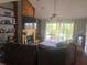 Living room with built-in shelves, fireplace, ceiling fan, and sliding glass doors to the outdoor patio at 1425 Corner Oaks Dr, Brandon, FL 33510