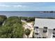 Waterfront condo positioned near tranquil bay with thriving green vegetation at 1500 Sunset Rd # C7, Tarpon Springs, FL 34689