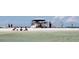A bustling beach scene with families enjoying water activities, showcasing a vibrant and lively coastal community at 1500 Sunset Rd # C7, Tarpon Springs, FL 34689