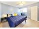 Bedroom with a work desk, chair, and a window that brings in natural light at 1500 Sunset Rd # C7, Tarpon Springs, FL 34689