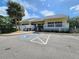 Community clubhouse with ample parking and a welcoming entrance for residents and guests at 1500 Sunset Rd # C7, Tarpon Springs, FL 34689