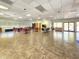 Community room featuring an open layout with various tables, seating, and activity spaces at 1500 Sunset Rd # C7, Tarpon Springs, FL 34689