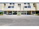 Exterior view of building complex with covered parking at 1500 Sunset Rd # C7, Tarpon Springs, FL 34689