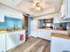 Bright kitchen boasts white cabinets, a wood countertop, and modern appliances for efficient cooking at 1500 Sunset Rd # C7, Tarpon Springs, FL 34689