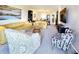 Spacious living room featuring elegant seating arrangements and ample natural light with a tv at 1500 Sunset Rd # C7, Tarpon Springs, FL 34689