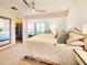 The main bedroom features a ceiling fan, a closet, and large windows at 1500 Sunset Rd # C7, Tarpon Springs, FL 34689