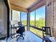 Bright and airy patio features an office setup and stunning views of the natural landscape at 1500 Sunset Rd # C7, Tarpon Springs, FL 34689