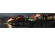 Night view of a pier adorned with colorful umbrellas, creating a vibrant and lively atmosphere at 1500 Sunset Rd # C7, Tarpon Springs, FL 34689