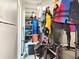 Organized storage area with shelving and hanging space for equipment and gear at 1500 Sunset Rd # C7, Tarpon Springs, FL 34689