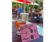 Outdoor seating at a Tarpon Springs brewery with beer and a map of local breweries at 1500 Sunset Rd # C7, Tarpon Springs, FL 34689