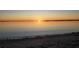 Beautiful sunset over calm waters reflecting the golden sunlight, creating a serene coastal ambiance at 1500 Sunset Rd # C7, Tarpon Springs, FL 34689