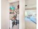 Walk-in closet with clothes, shelves, and storage at 1500 Sunset Rd # C7, Tarpon Springs, FL 34689