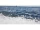 A close-up of ocean water with waves splashing, showcasing the dynamic movement and refreshing feel of the sea at 1500 Sunset Rd # C7, Tarpon Springs, FL 34689