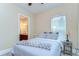 Bedroom with window, a gray bedspread, and ensuite bathroom at 15305 Fishhawk Preserve Dr, Lithia, FL 33547
