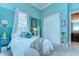 Bedroom featuring blue walls, plush carpet, and a large closet at 15305 Fishhawk Preserve Dr, Lithia, FL 33547
