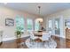 Bright dining area with hardwood floors, natural light, and a view to the exterior at 15305 Fishhawk Preserve Dr, Lithia, FL 33547